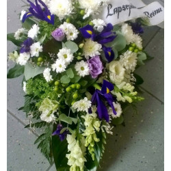 Funeral arrangement of white and purple flowers