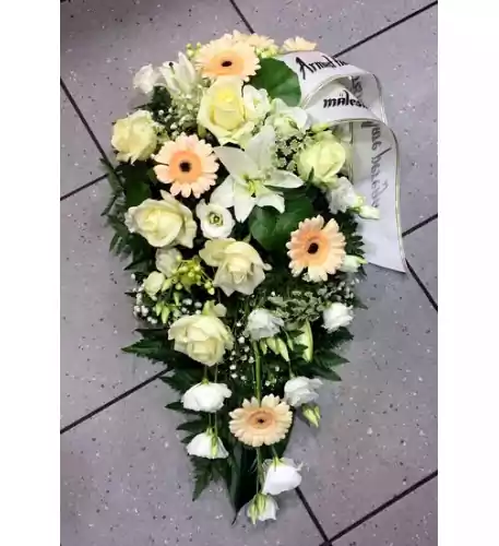 Funeral arrangement in white and creamy shades: rose, lilys, gerberas