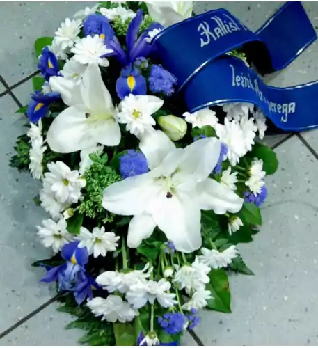 Funeral arrangement: white lilys, chrysanthemum, iris