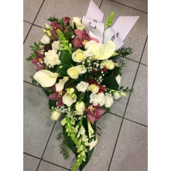 Funeral arrangements: dark orchids, white roses, lisianthus and callas