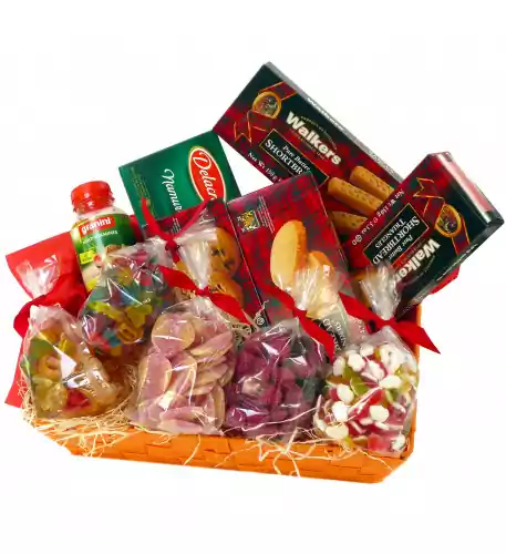 Candy basket with fruit juice, cookies and soft candies
