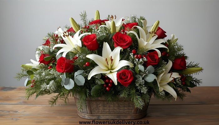 Christmas flowers UK delivery featuring red roses and white lilies with festive greenery Placement: After this section